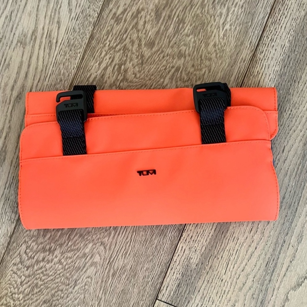 New Tumi Mobile Organizer Dimensions
6.0" X 11.0" X 1.3". Chilean Orange Color